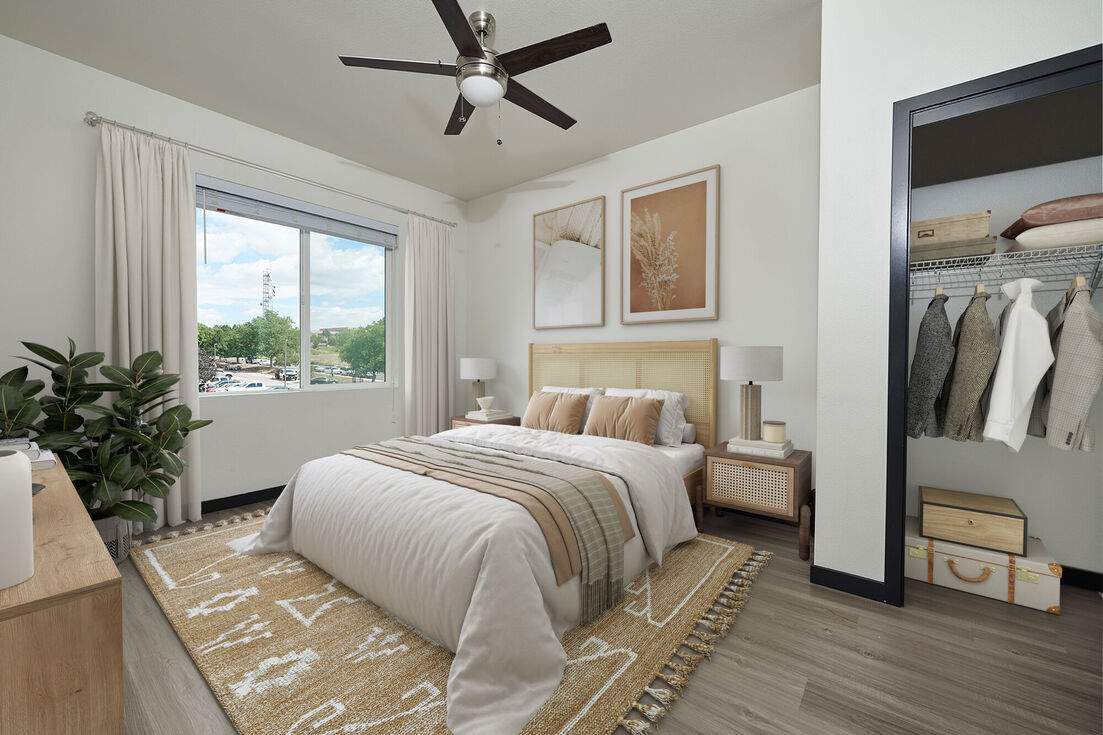 Bedroom with large window and walk in closet